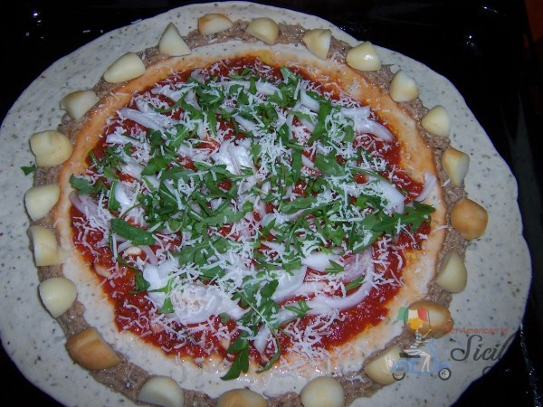 Pizza crust with sausage and cheese 